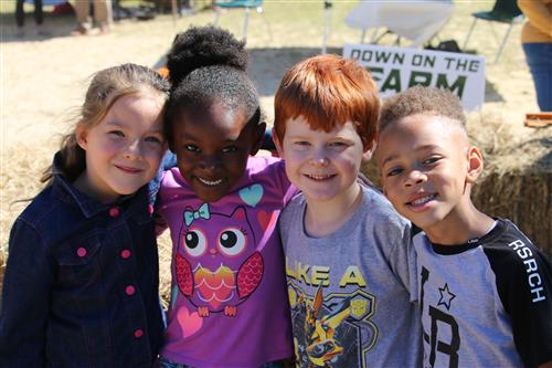 Four Kids Smiling at Field Day 